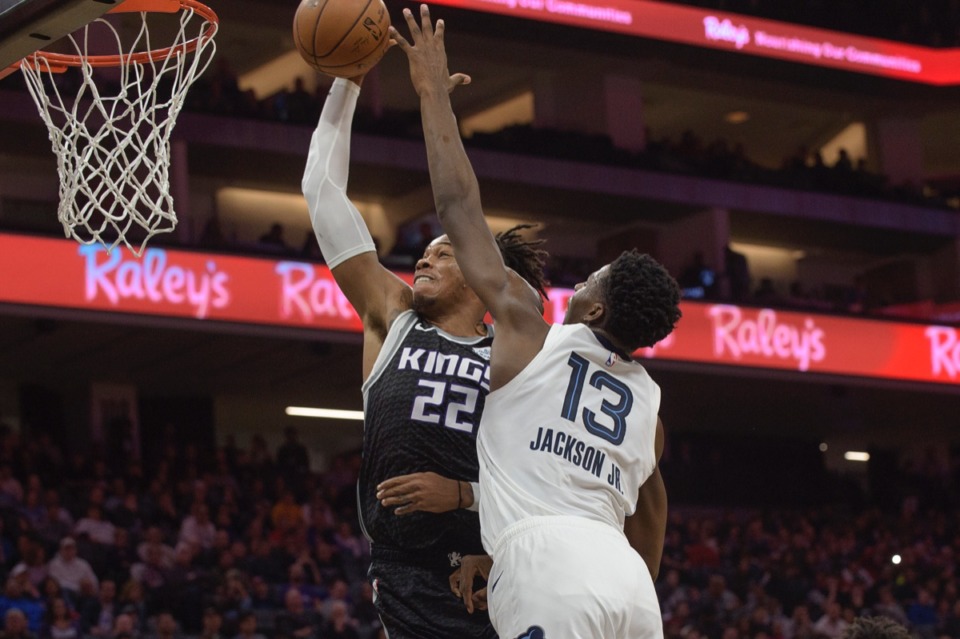 <strong>Sacramento Kings forward Richaun Holmes (22) scores against Memphis Grizzlies forward Jaren Jackson Jr. (13) in Sacramento, Calif., Thursday, Jan. 2, 2020.</strong> (Randall Benton/AP)