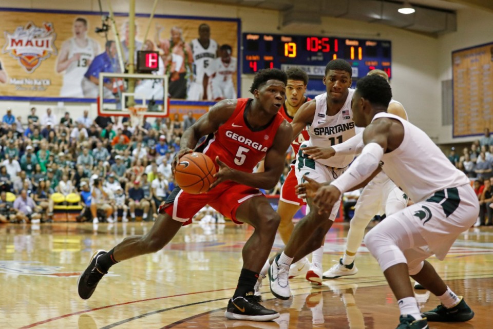 <strong>Georgia guard Anthony Edwards (5) drives into the Michigan State defense during the first half of an NCAA college basketball game Tuesday, Nov. 26, 2019, in Lahaina, Hawaii.</strong> (Marco Garcia/AP)