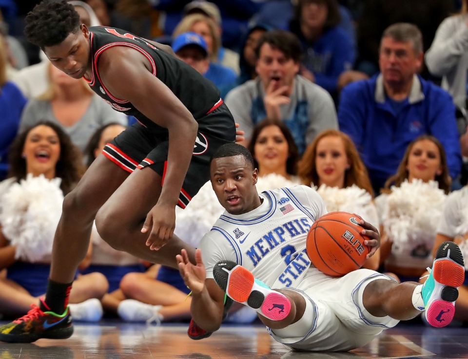 <strong>University of Memphis guard Alex Lomax (2) steals the ball from the Bulldogs' Anthony Edwards during the Tigers' game on Jan. 4, 2020, against Georgia at the FedExForum.</strong> (Jim Weber/Daily Memphian)
