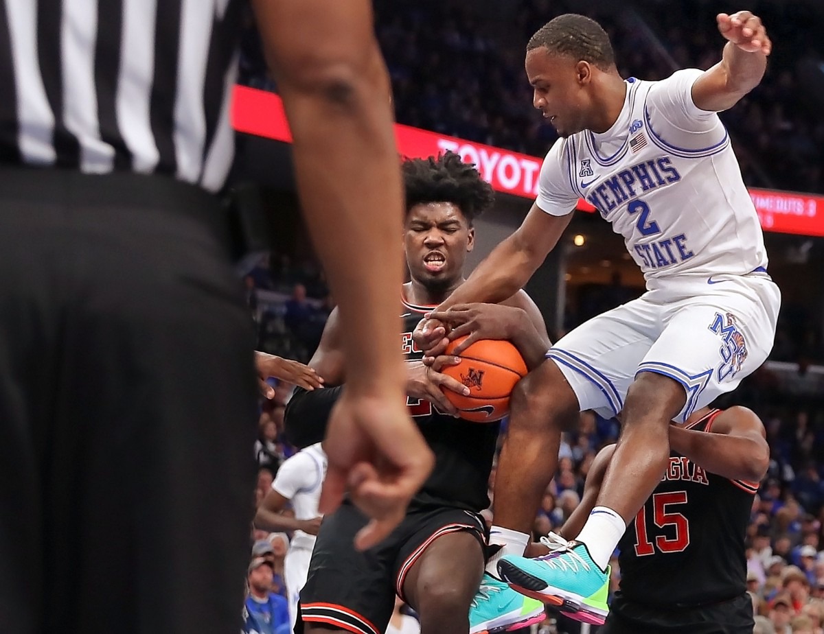 <strong>University of Memphis guard Alex Lomax (2) has the ball stripped away by the Bulldogs' Rayshaun Hammonds (center) during the Tigers' game on Jan. 4, 2020, against Georgia at the FedExForum.</strong> (Jim Weber/Daily Memphian)