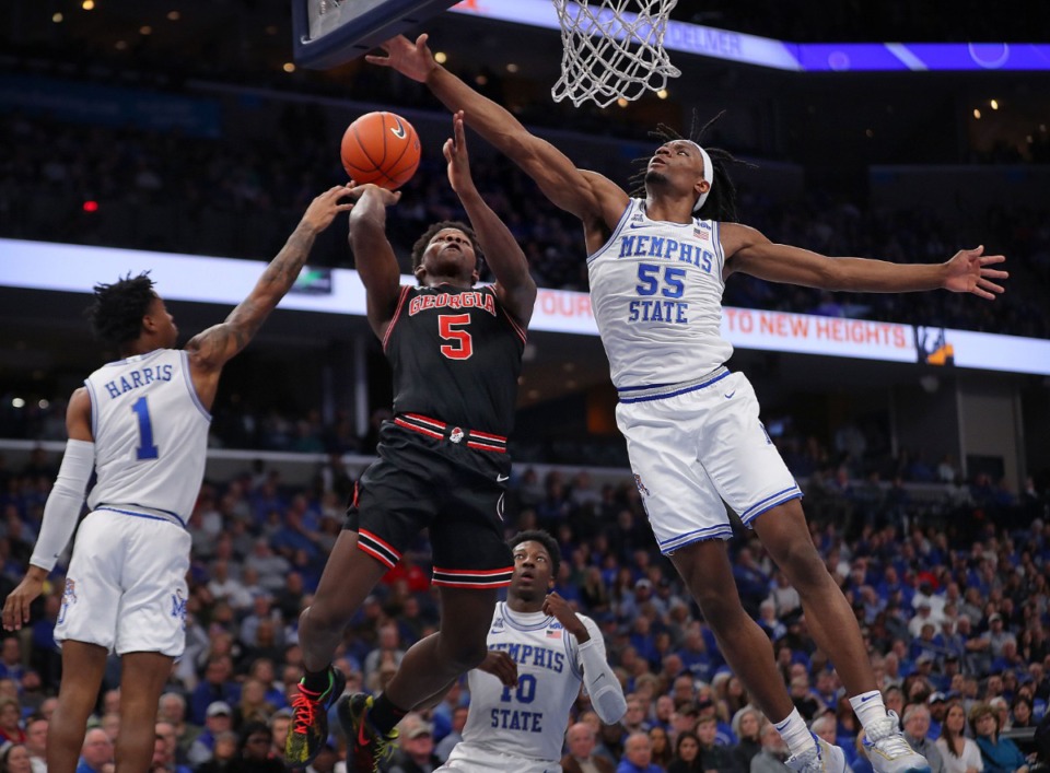 <strong>University of Memphis forward Precious Achiuwa (55) fouls the Bulldogs' Anthony Edwards (5) on s shot attempt during the Tigers' game on Jan. 4, 2020, against Georgia at the FedExForum.</strong> (Jim Weber/Daily Memphian)