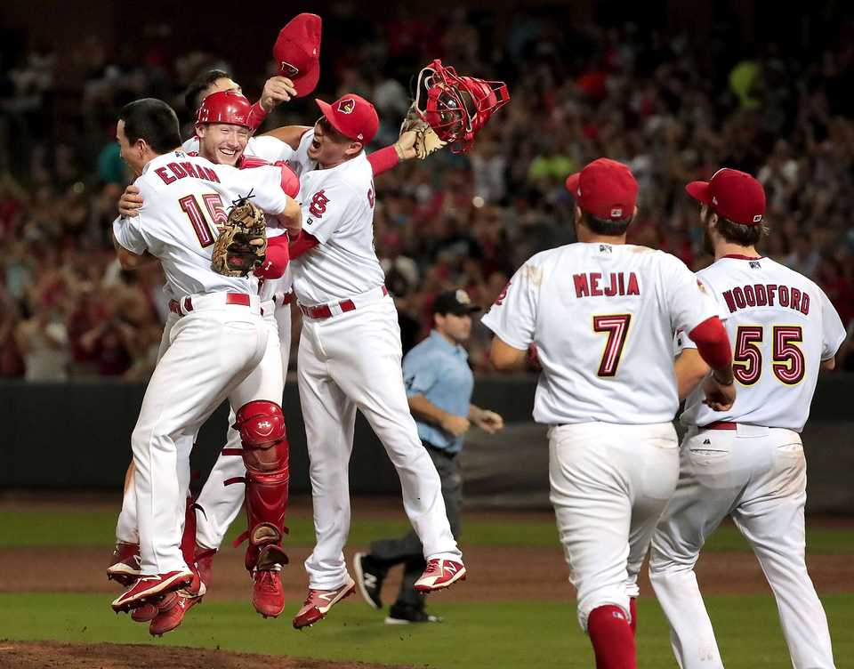 Redbirds players storm the mound to celebrate after winning Game 4 of the Pacific Coast League series against Fresno at AutoZone Park on Sept. 15. Memphis beat the Grizzlies 5-0 to win their second straight PCL title. (Jim Weber/Daily Memphian)
