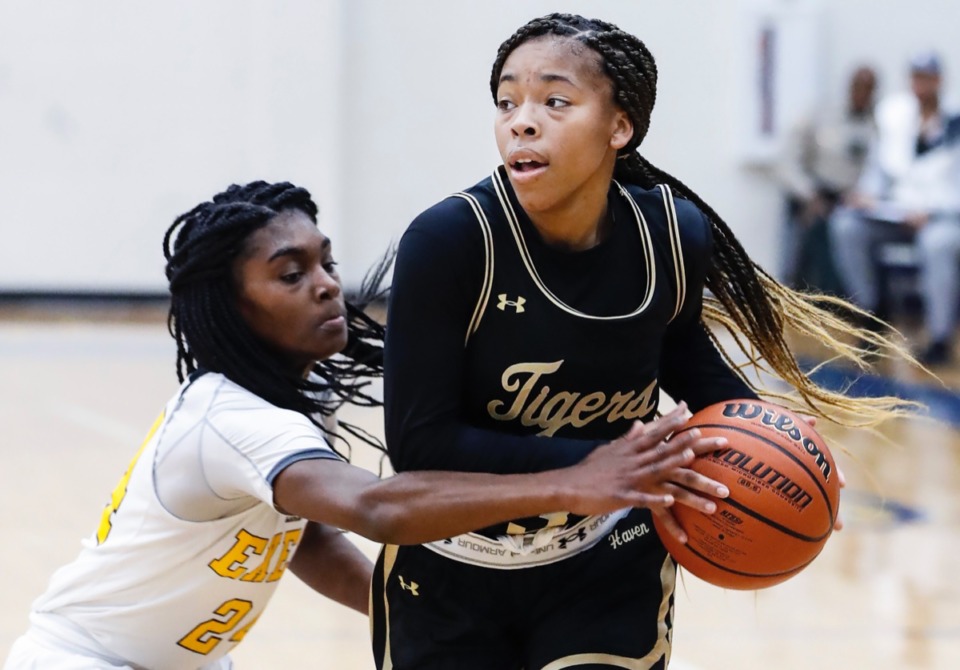 <strong>Whitehaven guard Se&rsquo;Quoia Allmond (right) drives the lane against Memphis Business Academy defender A'Nyah Rucker (left) Jan. 2, 2020, at Arlington High School.</strong> (Mark Weber/Daily Memphian)