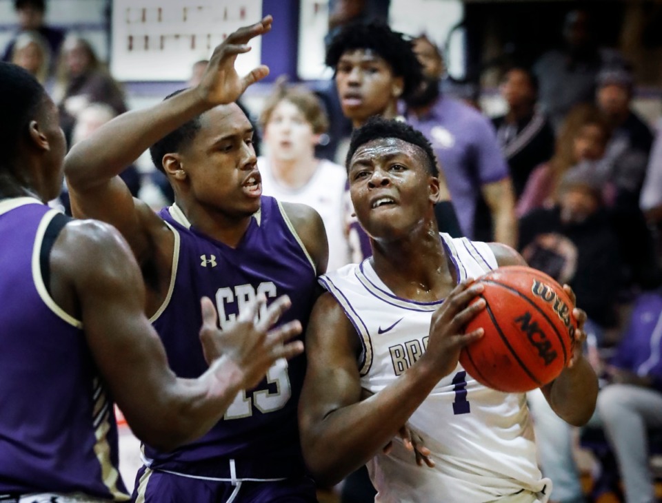 <strong>CBHS guard Chandler Jackson (right) drives the lane against St. Louis CBC defender Kyle Henderson (left) during action on Jan. 2, 2020, at National Hoopfest Memphis.</strong> (Mark Weber/Daily Memphian)