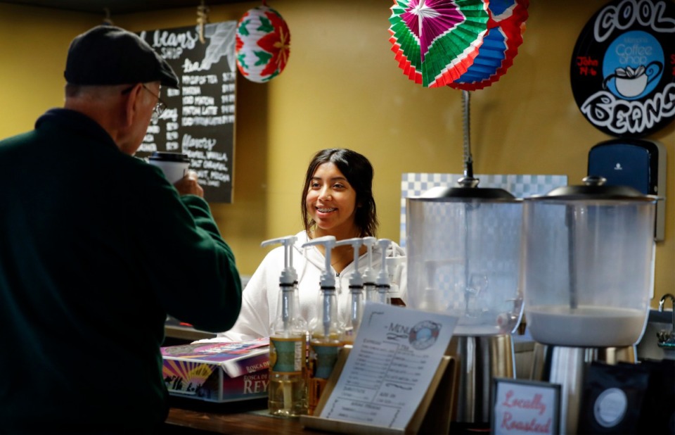 <strong>Cool Beans co-owner Brisa Rodriguez serves customers at the recently-opened coffee shop inside the Cordova International Farmer's Market on Jan. 6, 2020.</strong> (Mark Weber/Daily Memphian)