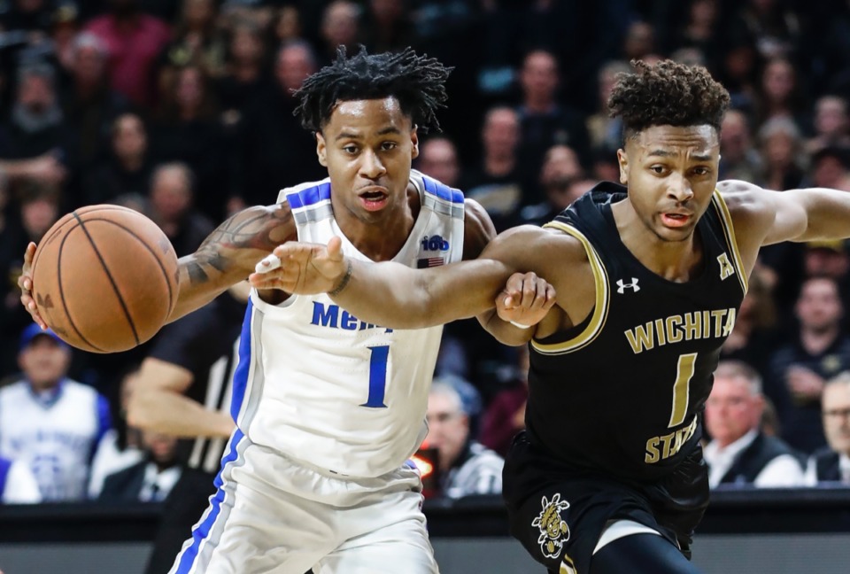 <strong>Memphis guard Tyler Harris (left) is called for a offensive foul while driving to the basket against Wichita State defender Tyson Etienne (right) Jan. 9, 2020, in Wichita, Kansas.</strong> (Mark Weber/Daily Memphian)