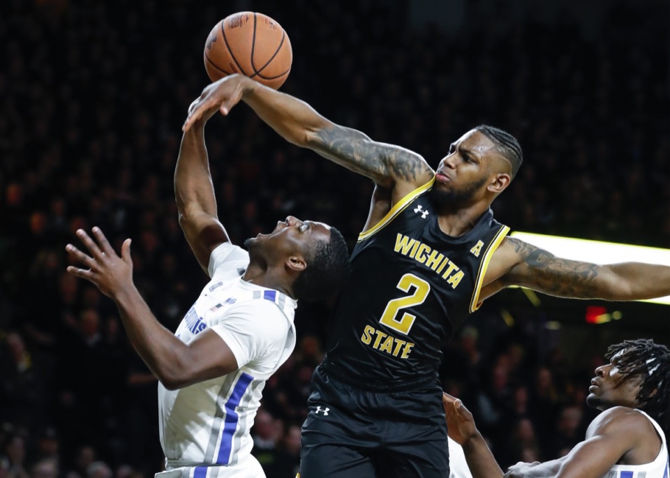 <strong>Memphis guard Alex Lomax (left) is fouled by Wichita State defender Jamarius Burton (right) while driving the lane Jan. 9, 2020, in Wichita, Kansas</strong>. (Mark Weber/Daily Memphian)