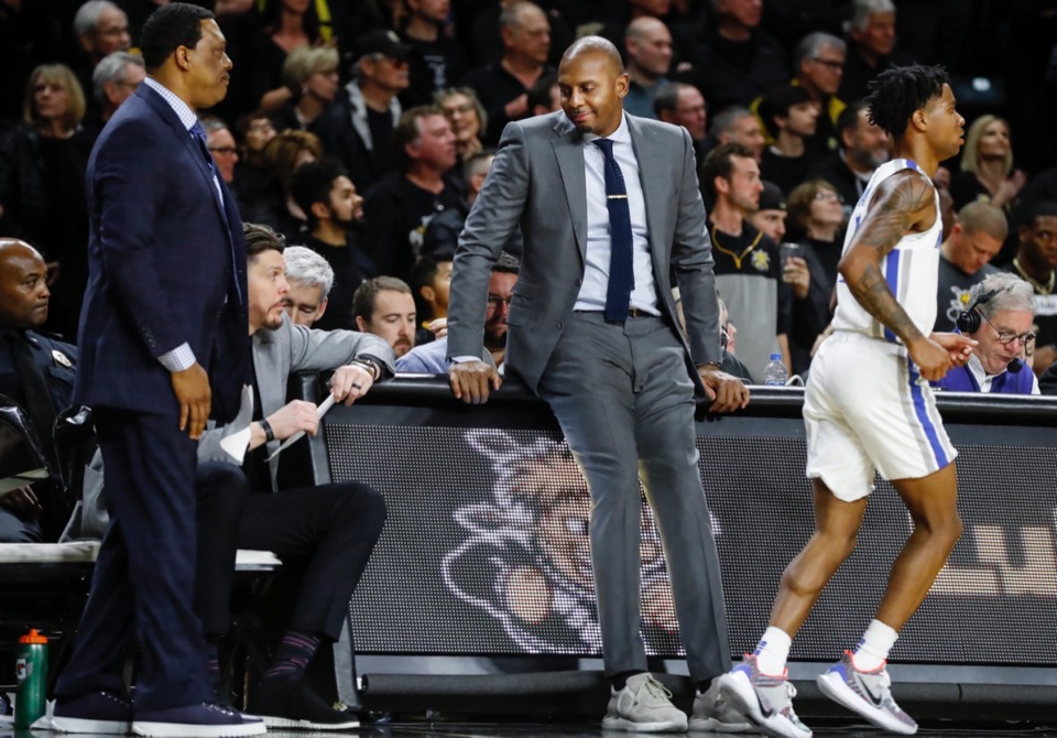 <strong>Memphis head coach Penny Hardaway (middle) sits on the scores table during the final minutes of a 76-67 loss to Wichita State Jan. 9, 2020, in Wichita, Kansas.</strong> (Mark Weber/Daily Memphian)