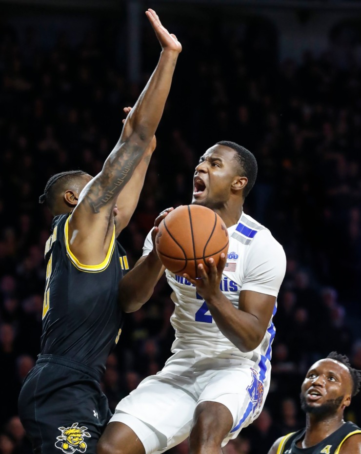 <strong>Memphis guard Alex Lomax (right) drives to the basket against Wichita State defender Jamarius Burton (left) during action&nbsp;on Jan. 9, 2020, in Wichita, Kansas.</strong> (Mark Weber/Daily Memphian)
