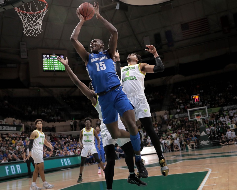 <strong>University of Memphis forward Lance Thomas shoots under pressure by the Bulls during the Tigers' game on Sun., Jan. 12, 2020, against USF at the Yuengling Center.</strong> (Jim Weber/Daily Memphian)