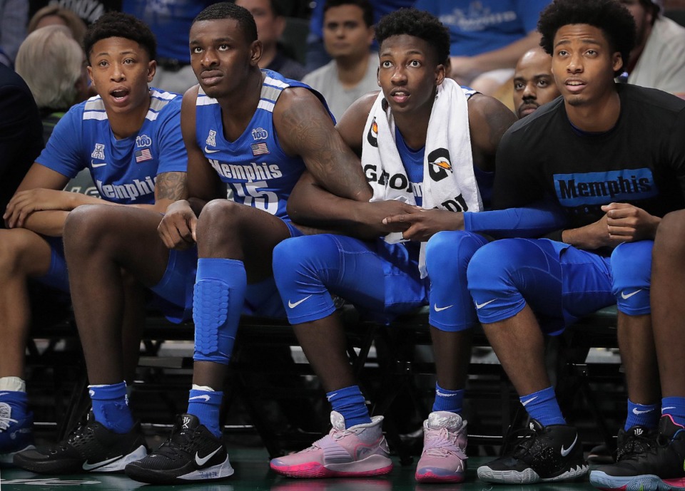 <strong>University of Memphis' Boogie Ellis (left) Lance Thomas, Damion Baugh and Jayden Hardaway watch a Tigers free throw in the final seconds of the Tigers' game on Jan. 12, 2020, against USF at the Yuengling Center.</strong> (Jim Weber/Daily Memphian)