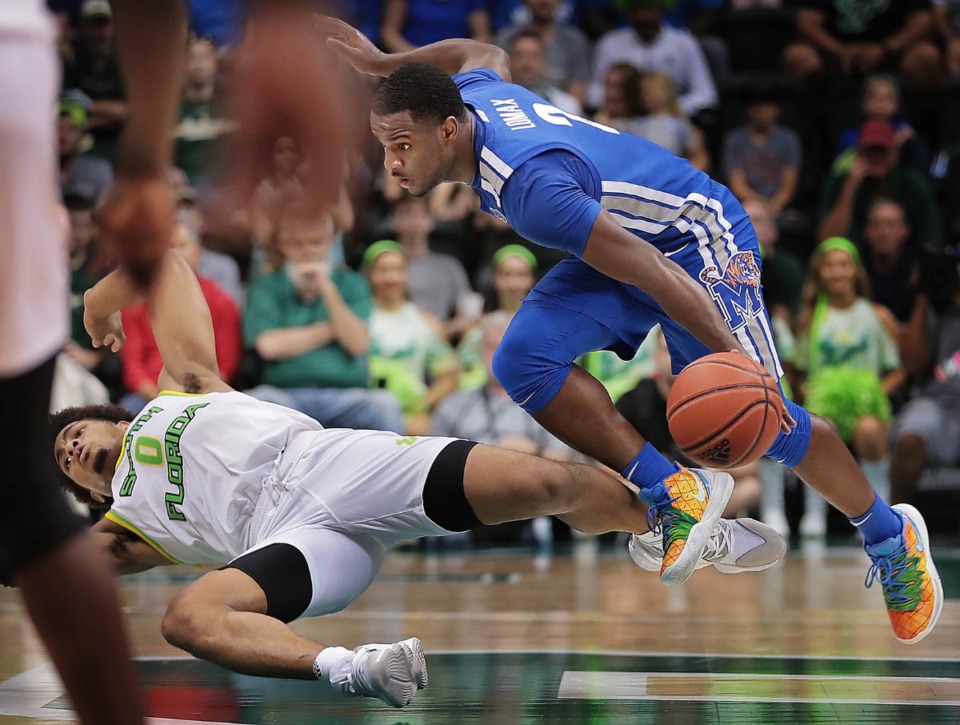 <strong>University of Memphis guard Alex Lomax (2) collides with the Bulls' David Collins during the Tigers' game on Jan. 12, 2020, against USF at the Yuengling Center.</strong> (Jim Weber/Daily Memphian)