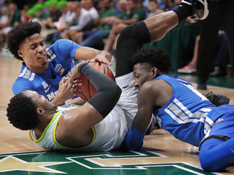 <strong>University of Memphis guard Jayden Hardaway battles for a loose ball with the Bulls' Laquincy Rideau during the Tigers' game on Jan. 12, 2020, against USF at the Yuengling Center.</strong> (Jim Weber/Daily Memphian)