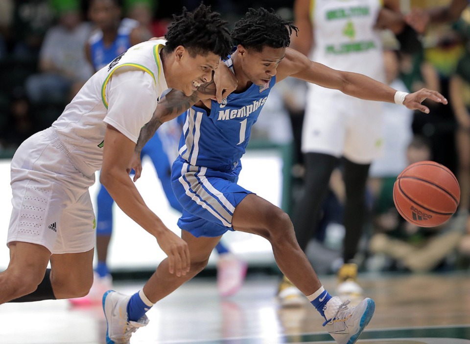 <strong>University of Memphis guard Tyler Harris scrambles for a loose ball against the Bulls' Xavier Castaneda during the Tigers' game on Jan. 12, 2020, against USF at the Yuengling Center in Tampa, Florida.</strong> (Jim Weber/Daily Memphian)