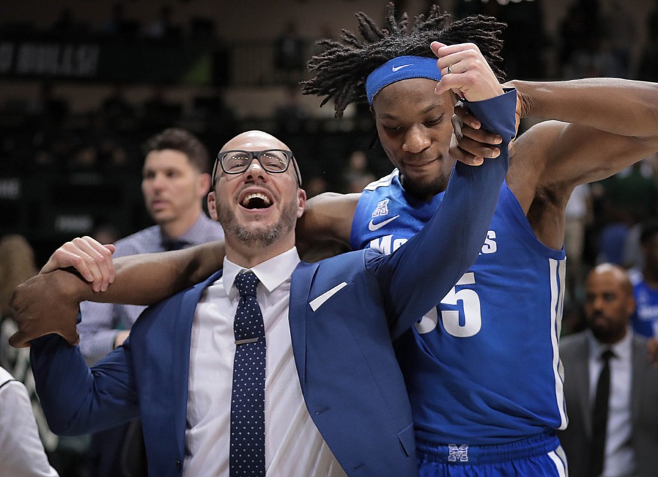<strong>University of Memphis forward Precious Achiuwa celebrates with assistant coach Cody Toppert after the Tigers' win over USF Bulls on Jan. 12, 2020, at the Yuengling Center in Tampa, Florida.</strong> (Jim Weber/Daily Memphian)