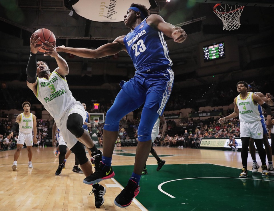 <strong>University of Memphis forward Malcolm Dandridge (23) battles the Bulls' Laquincy Rideau for a rebound during the Tigers' game on Jan. 12, 2020, against USF at the Yuengling Center.</strong> (Jim Weber/Daily Memphian)