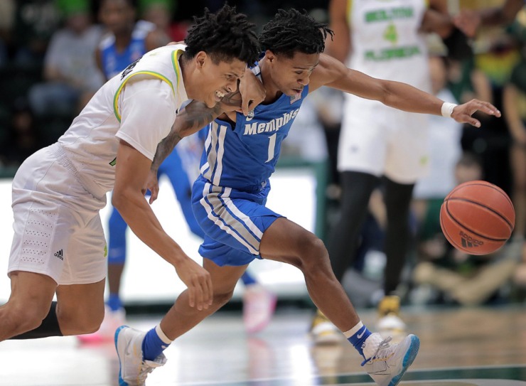 <strong>University of Memphis guard Tyler Harris scrambles for a loose ball against the Bulls' Xavier Castaneda during the Tigers' game on Jan. 12, 2020, against USF at the Yuengling Center in Tampa, Fla.</strong> (Jim Weber/Daily Memphian)