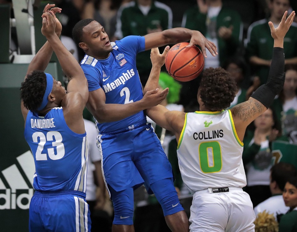 <strong>University of Memphis guard Alex Lomax (2) battles for a rebound with the Bulls' David Collins during the Tigers' game on Jan. 12, 2020, against USF at the Yuengling Center.</strong> (Jim Weber/Daily Memphian)