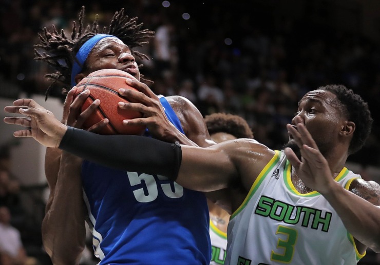 <strong>University of Memphis forward Precious Achiuwa (55) pulls down a rebound under pressure by the Bulls' Laquincy Rideau during the Tigers' game on Jan. 12, 2020, against USF&nbsp;at the Yuengling Center in Tampa, Fla. </strong>(Jim Weber/Daily Memphian)