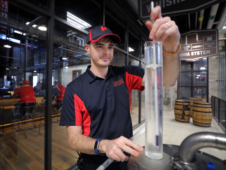 <strong>Matt Cameron, production supervisor with Old Dominick Distillery, checks the alcohol volume for a particular batch of whiskey Jan. 13, 2020.</strong> (Patrick Lantrip/Daily Memphian)