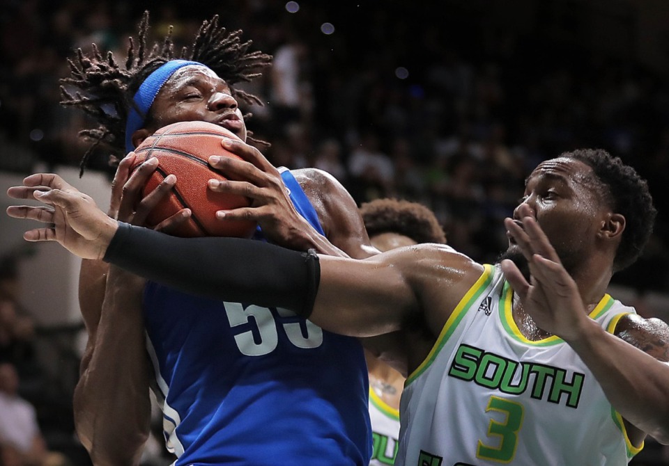 <strong>University of Memphis forward Precious Achiuwa (55) pulls down a rebound under pressure by the Bulls' Laquincy Rideau during the Tigers' game on Jan. 12, 2020, against USF at the Yuengling Center in Tampa, Florida.</strong> (Jim Weber/Daily Memphian)