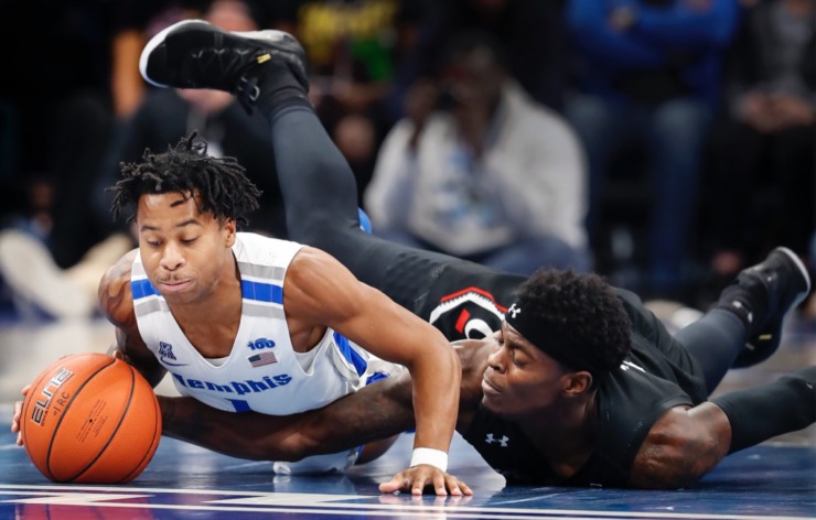 <strong>Tyler Harris (left) and Cincinnati forward Tre Scott (right) end up on the floor while chasing a loose ball during action Thursday, Jan. 16, 2020, at the FedExForum.</strong> (Mark Weber/Daily Memphian)