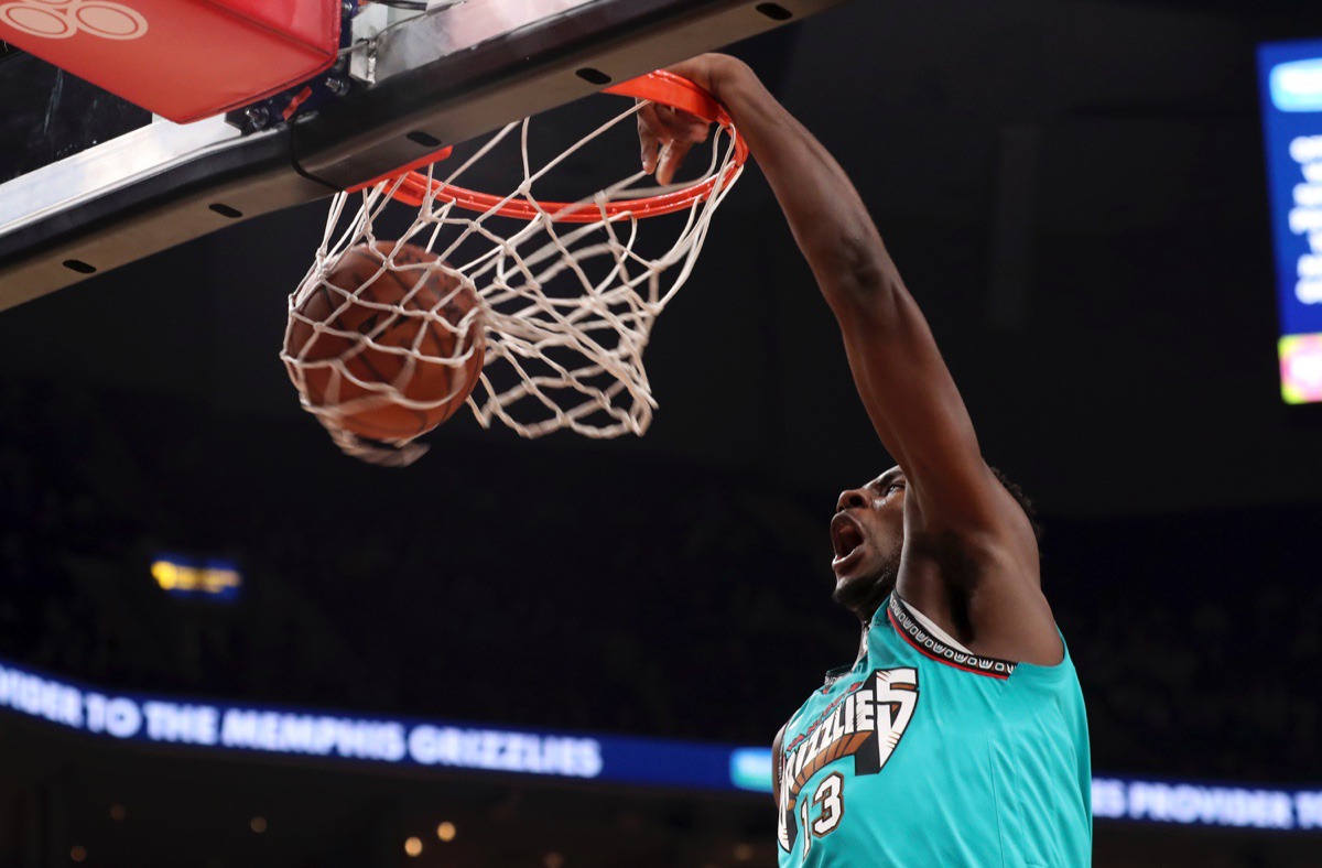 <strong>Memphis Grizzlies' Jaren Jackson Jr. (13) dunks during the first half of the team's NBA basketball game against Cleveland Cavaliers on Friday, Jan. 17, 2020, at FeExForum.</strong> (Karen Pulfer Focht/AP)