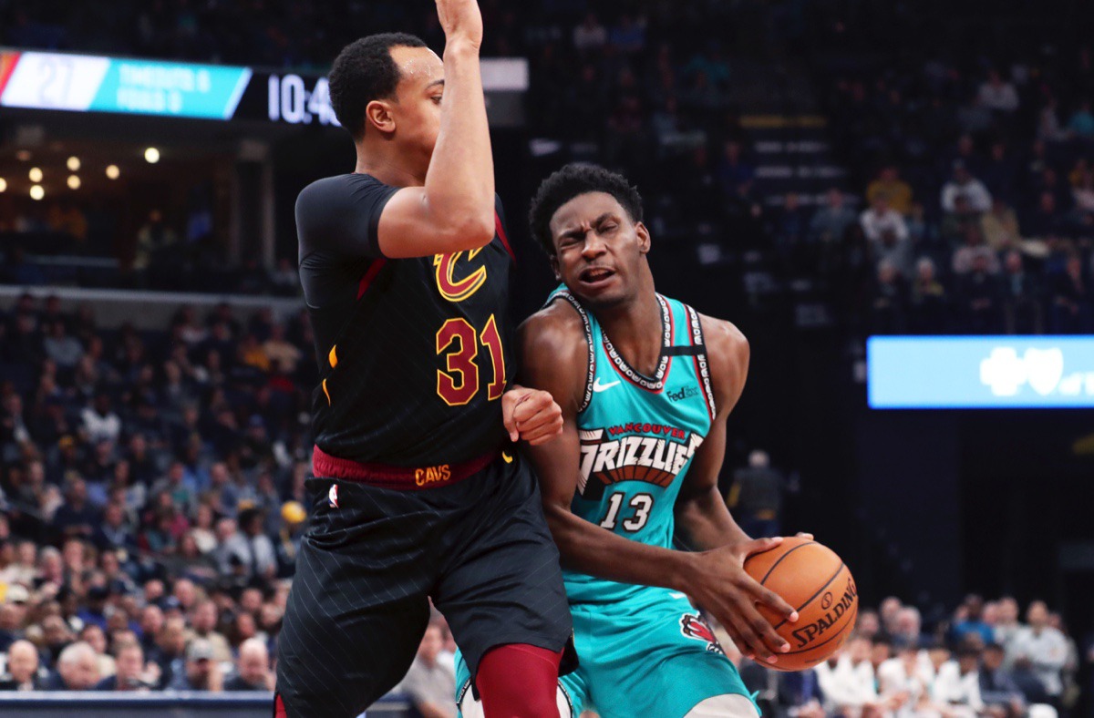 <strong>Memphis Grizzlies forward Jaren Jackson Jr. (13) presses past Cleveland Cavaliers forward John Henson (31) Friday, Jan. 17, 2020, at FedExForum.</strong> (Karen Pulfer Focht/AP)