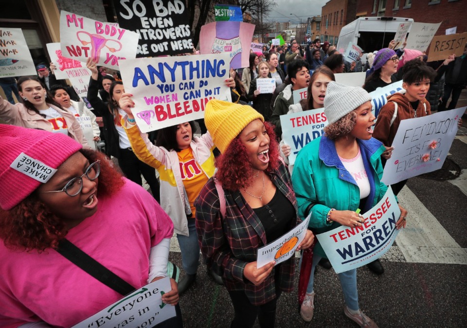 <strong>Sisters Jordan Serca (left), Sa'Maira Serca and Chloe Serca chant for unity during the Memphis Women's March Downtown on Jan. 18, 2020, as over 250 women's rights advocates gathered in the shadow of a looming election year to build awareness for equality, reproductive rights and discrimination issues.</strong> (Jim Weber/Daily Memphian)
