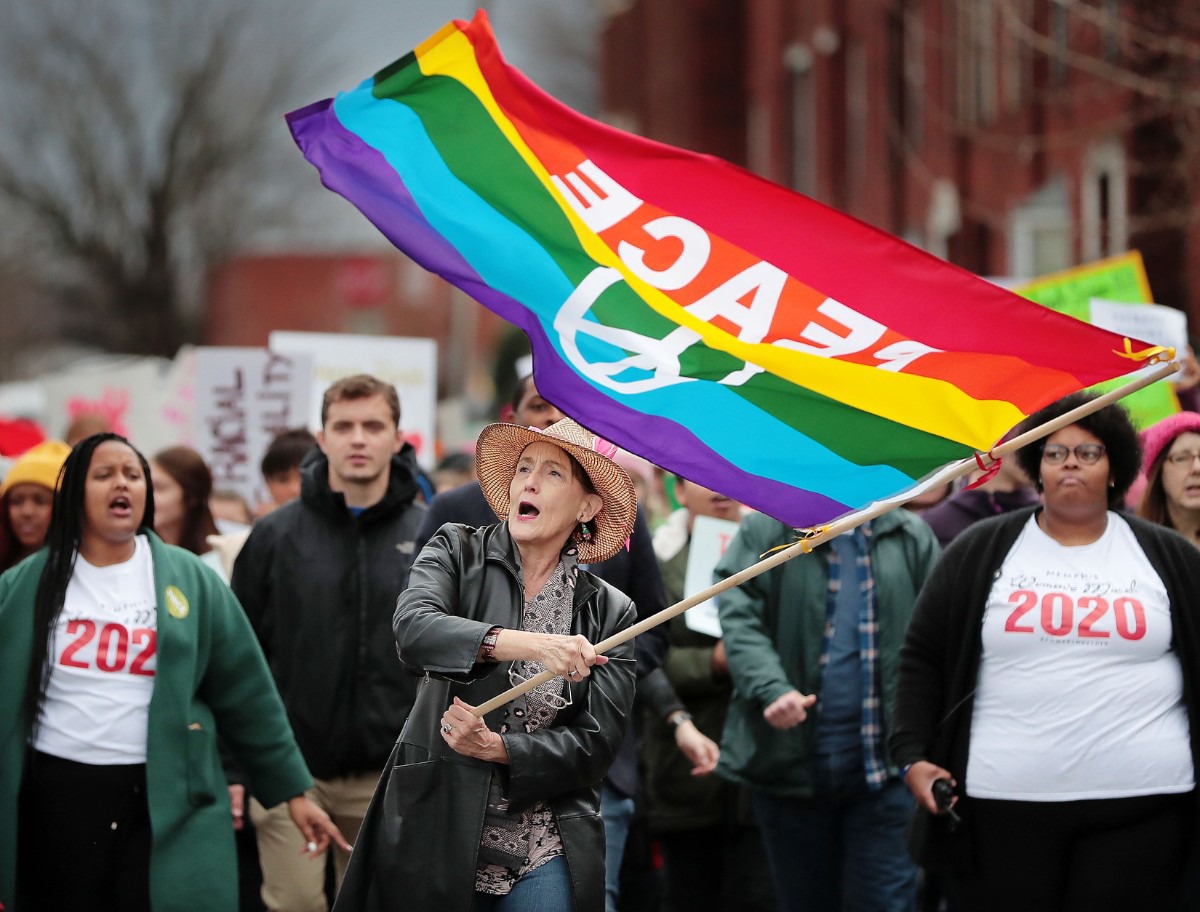 <strong>Patty Crawford (center) leads the Memphis Women's March Downtown on Jan. 18, 2020, as over 250 women's rights advocates gathered in the shadow of a looming election year to build awareness for equality, reproductive rights and discrimination issues.</strong> (Jim Weber/Daily Memphian)