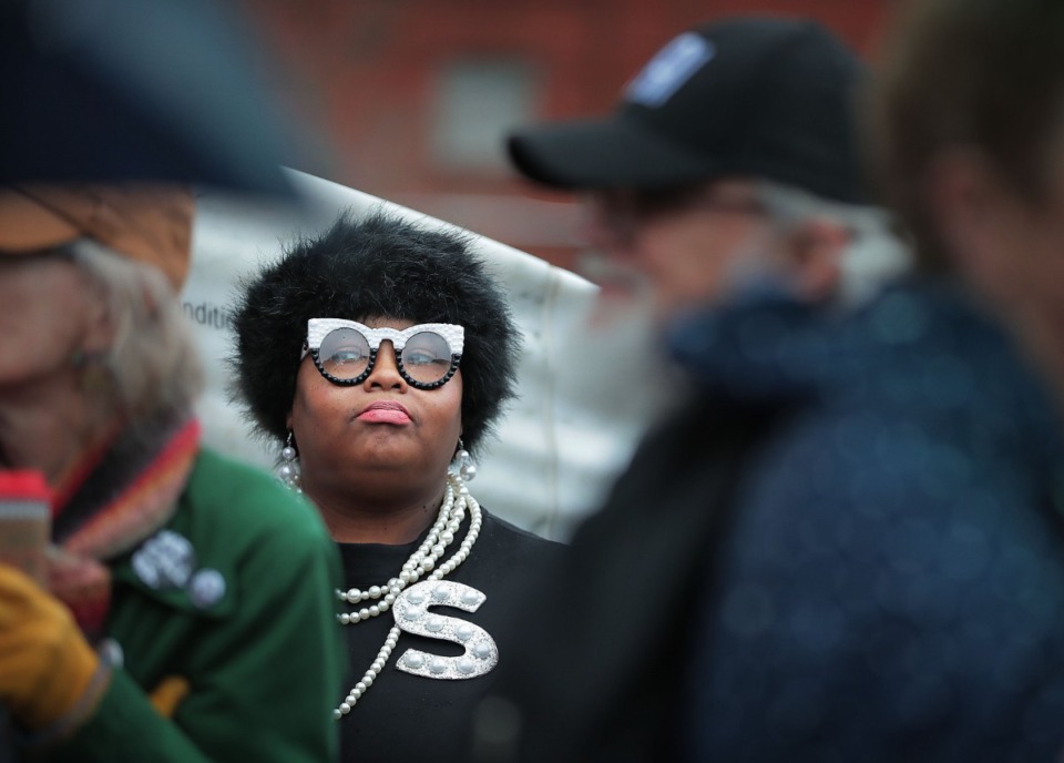 <strong>Shelica Cox waits in the rain at Clayborn Temple before the start of the Memphis Women's March Downtown on Jan. 18, 2020, as over 250 women's rights advocates gathered in the shadow of a looming election year to build awareness for equality, reproductive rights and discrimination issues.</strong> (Jim Weber/Daily Memphian)