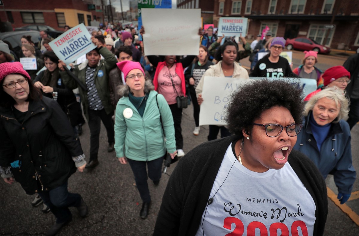 <strong>Event organizer Amber Sherman (right) leads chants for unity during the Memphis Women's March Downtown on Jan. 18, 2020, as over 250 women's rights advocates gathered in the shadow of a looming election year to build awareness for equality, reproductive rights and discrimination issues.</strong> (Jim Weber/Daily Memphian)