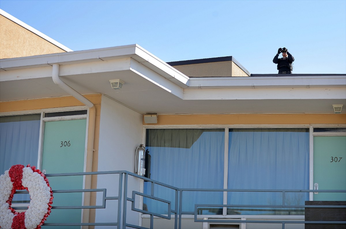 <strong>A Secret Service team member keeps watch above the motel room where Dr. Martin Luther King Jr. was slain.</strong> (Patrick Lantrip/Daily Memphian)