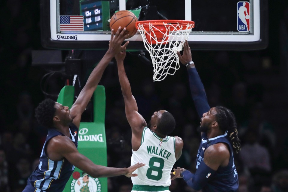 <strong>Celtics guard Kemba Walker (8) threads between Memphis Grizzlies forward Jae Crowder, right, and Memphis Grizzlies forward Jaren Jackson Jr., left, Jan. 22, 2020, in Boston.</strong> (Charles Krupa/AP)