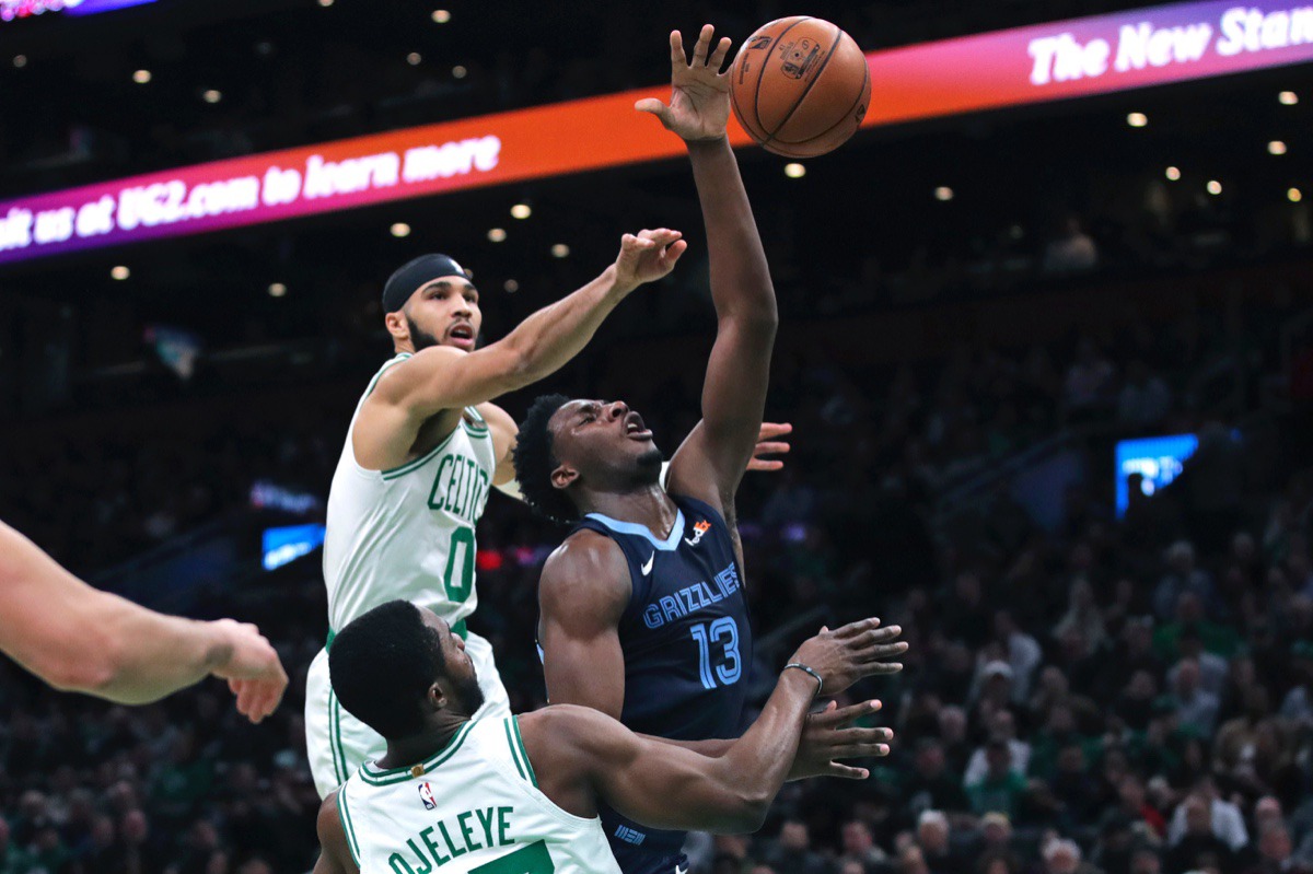 <strong>Memphis Grizzlies forward Jaren Jackson Jr. (13) drives past Celtics forwards Jayson Tatum (0) and Semi Ojeleye (37) Jan. 22, 2020, in Boston.</strong> (Charles Krupa/AP)