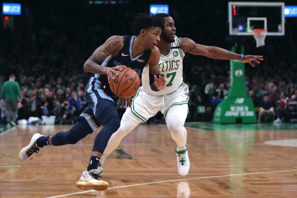 <strong>Memphis Grizzlies guard Ja Morant, left, drives past Celtics forward Semi Ojeleye (37) Jan. 22, 2020, in Boston.</strong> (Charles Krupa/AP)