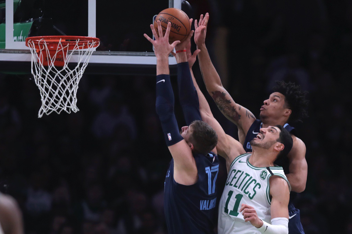 <strong>Celtics center Enes Kanter (11) battles for a rebound against Memphis Grizzlies center Jonas Valanciunas (17) and forward Brandon Clarke Jan. 22, 2020, in Boston.</strong>&nbsp;Charles Krupa/AP)