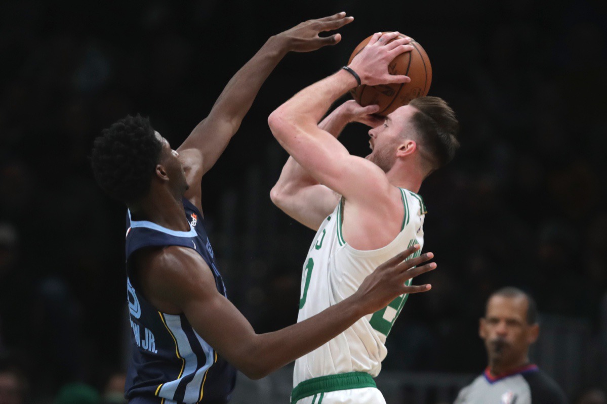 <strong>Memphis Grizzlies forward Jaren Jackson Jr., left, tries to block Celtics forward Gordon Hayward Jan. 22, 2020, in Boston.</strong> (AP Photo/Charles Krupa)