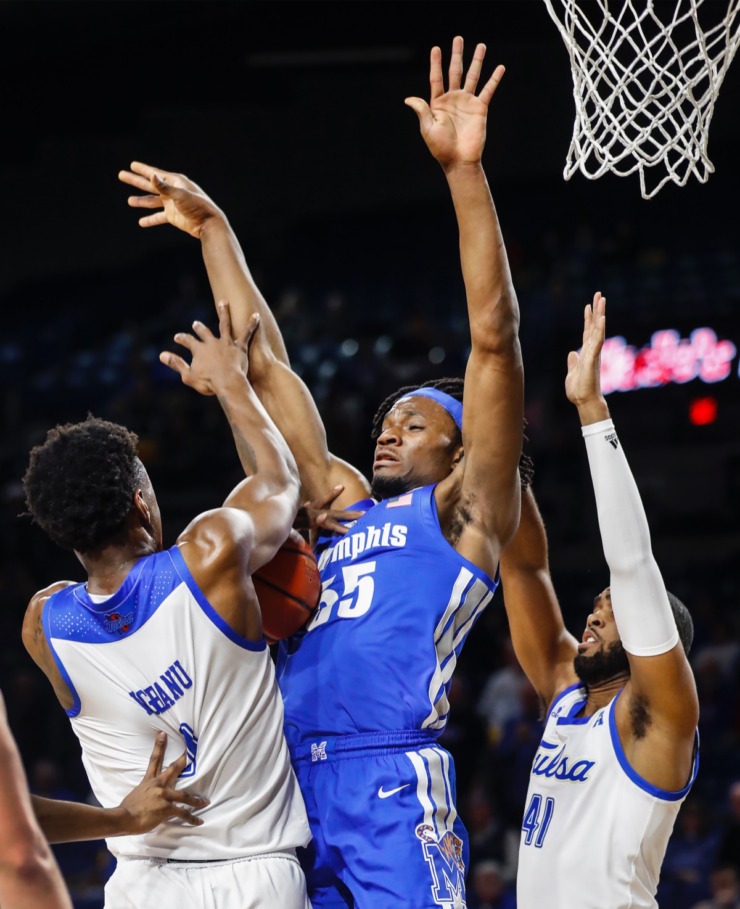 <strong>Memphis forward Precious Achiuwa (middle) loses control of the ball while guarded by Hurricane defenders Brandon Rachal (left) and Jeriah Horne (right) Wednesday, Jan. 22, 2020, in Tulsa, Oklahoma.</strong> (Mark Weber/Daily Memphian)