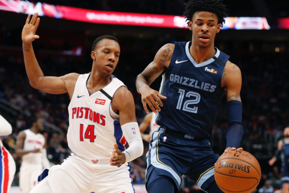 <strong>Memphis Grizzlies guard Ja Morant (12) controls the ball as Detroit Pistons forward Louis King (14) defends during the first half of an NBA basketball game, Friday, Jan. 24, 2020, in Detroit.</strong> (Carlos Osorio/AP)