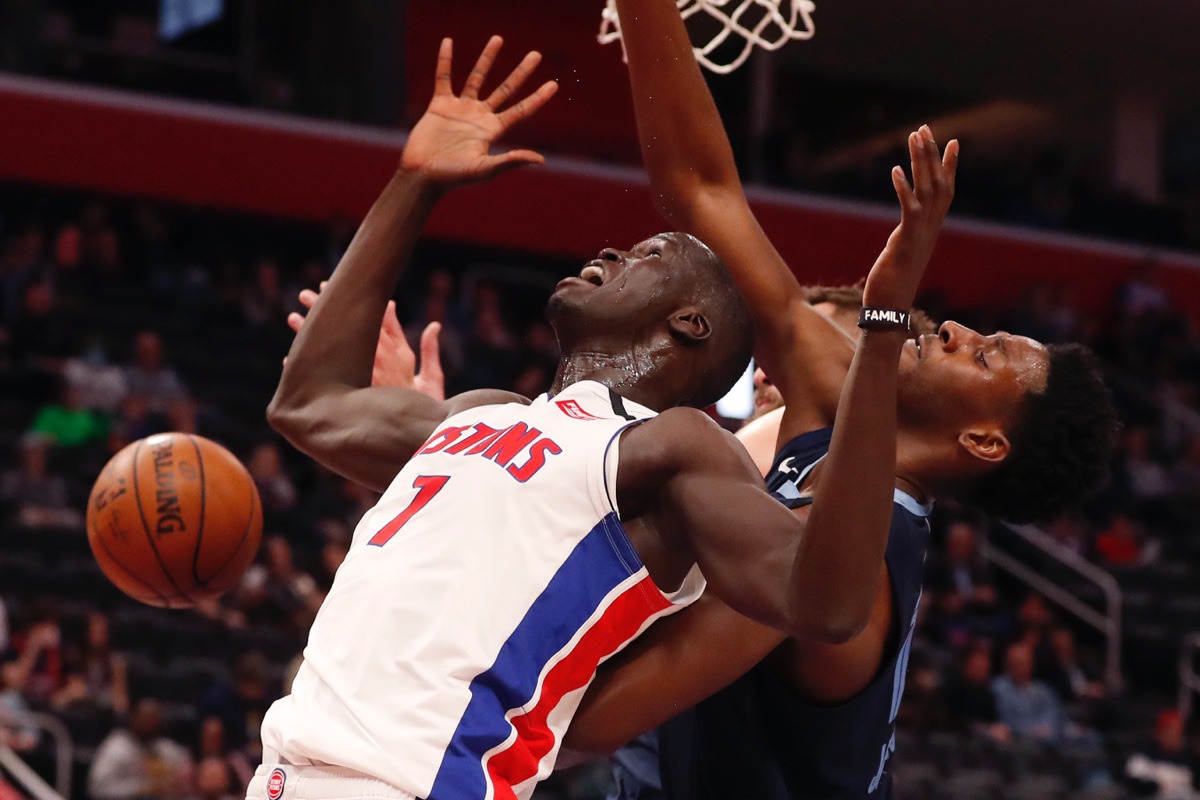 <strong>Detroit Pistons forward Thon Maker (7) loses control of the ball after being fouled by Memphis Grizzlies forward Jaren Jackson Jr., right, during the second half of an NBA basketball game, Friday, Jan. 24, 2020, in Detroit.</strong> (Carlos Osorio/AP)
