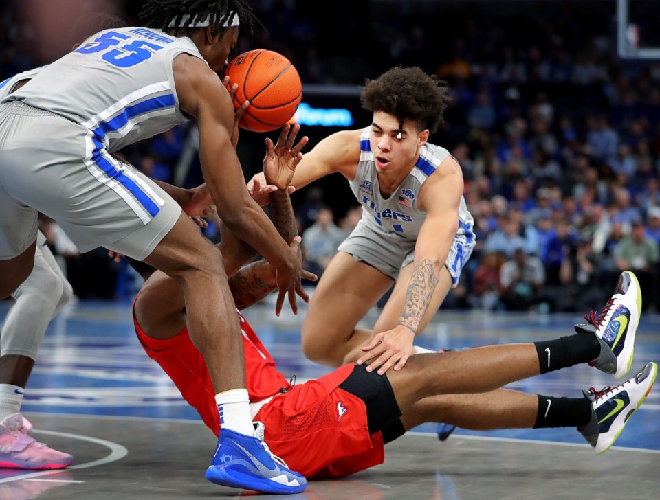 <strong>University of Memphis guard Lester Quinones (11) and Precious Achiuwa (55) scramble for a loose ball with the Mustangs' Tyson Jolly during the Tigers' game on Jan. 25, 2020, against SMU at the FedExForum.</strong> (Jim Weber/Daily Memphian)