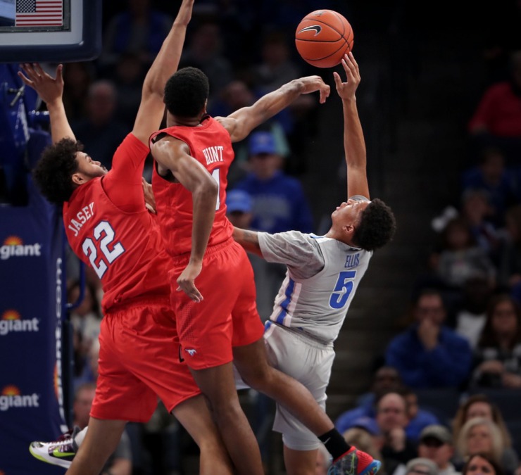 University of Memphis guard Boogie Ellis (5) shoots under pressure by the Mustangs' Feron Hunt (1) and Isiah Jasey (22) during the Tigers' game on Jan. 25, 2020, against SMU at the FedExForum. (Jim Weber/Daily Memphian)