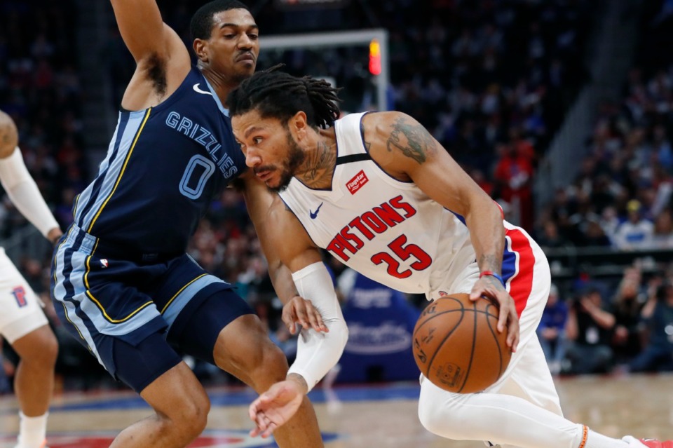 <strong>Detroit Pistons guard Derrick Rose (25) drives on Memphis Grizzlies guard De'Anthony Melton (0) during the second half of an NBA basketball game, Friday, Jan. 24, 2020, in Detroit.</strong> (AP Photo/Carlos Osorio)