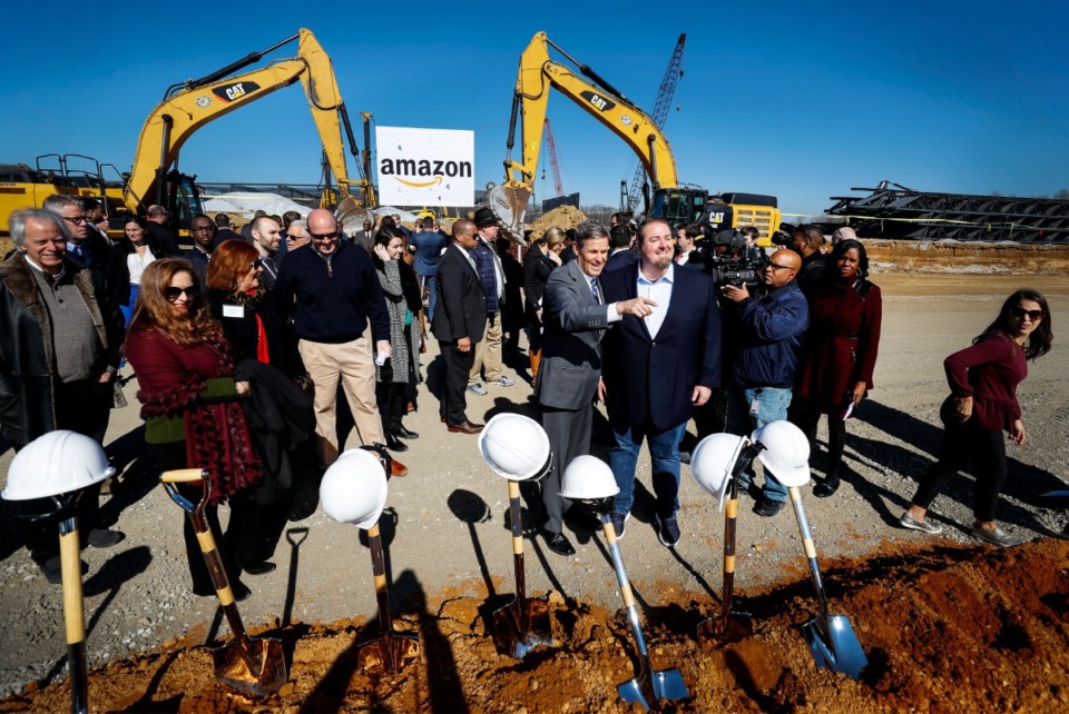 <strong>Tenn. Gov. Bill Lee (middle left) and Amazon Director of Regional Operations Rob Packett (middle right) take pictures with each other after a press conference announcing a new Amazon fulfillment center Jan. 27, 2020, on the Raleigh-Frayser border.</strong> (Mark Weber/Daily Memphian)