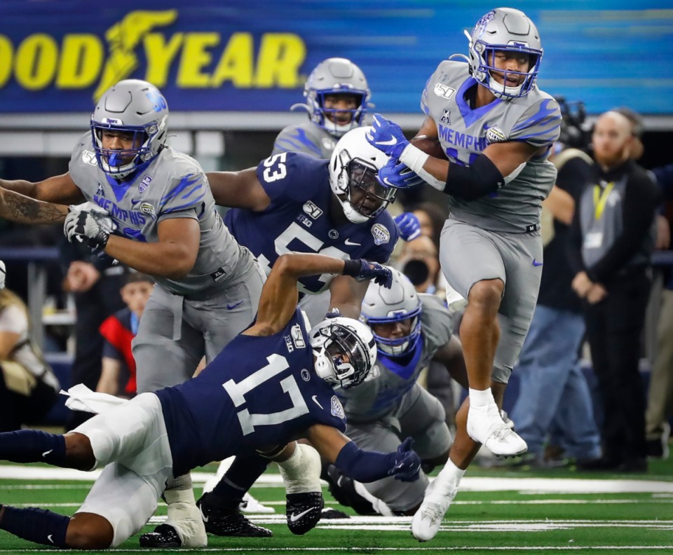 <strong>Memphis receiver Antonio Gibson (right) looks for positive yards against the Penn State defense during the Cotton Bowl on Dec. 28, 2019, at AT&amp;T Stadium in Arlington, Texas.</strong> (Mark Weber/Daily Memphian)