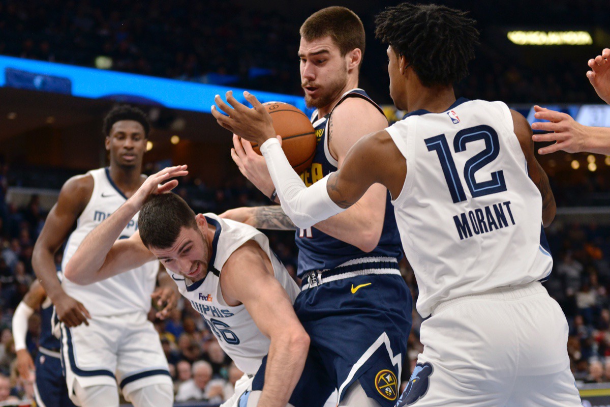 <strong>Denver Nuggets forward Juan Hernangomez, center, struggles to control the ball between Memphis Grizzlies guards John Konchar (46) and Ja Morant (12) Jan. 28, 2020,</strong>&nbsp;<strong>at FedExForum.</strong> (Brandon Dill/AP)