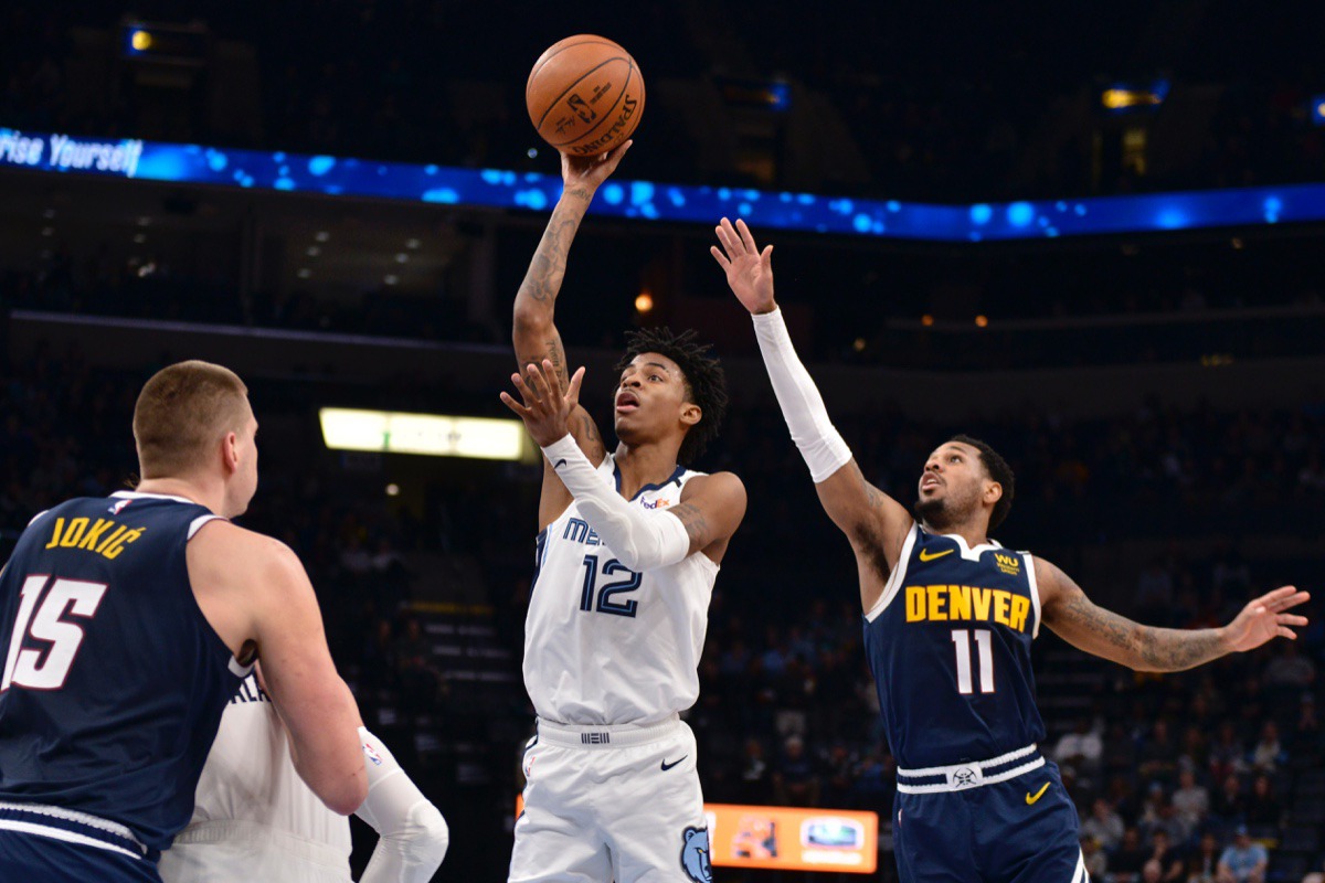 <strong>Memphis Grizzlies guard Ja Morant (12) shoots ahead of Denver Nuggets guard Monte Morris (11) in the second half of an NBA basketball game Tuesday, Jan. 28, 2020, at FedExForum.</strong> (Brandon Dill/AP)
