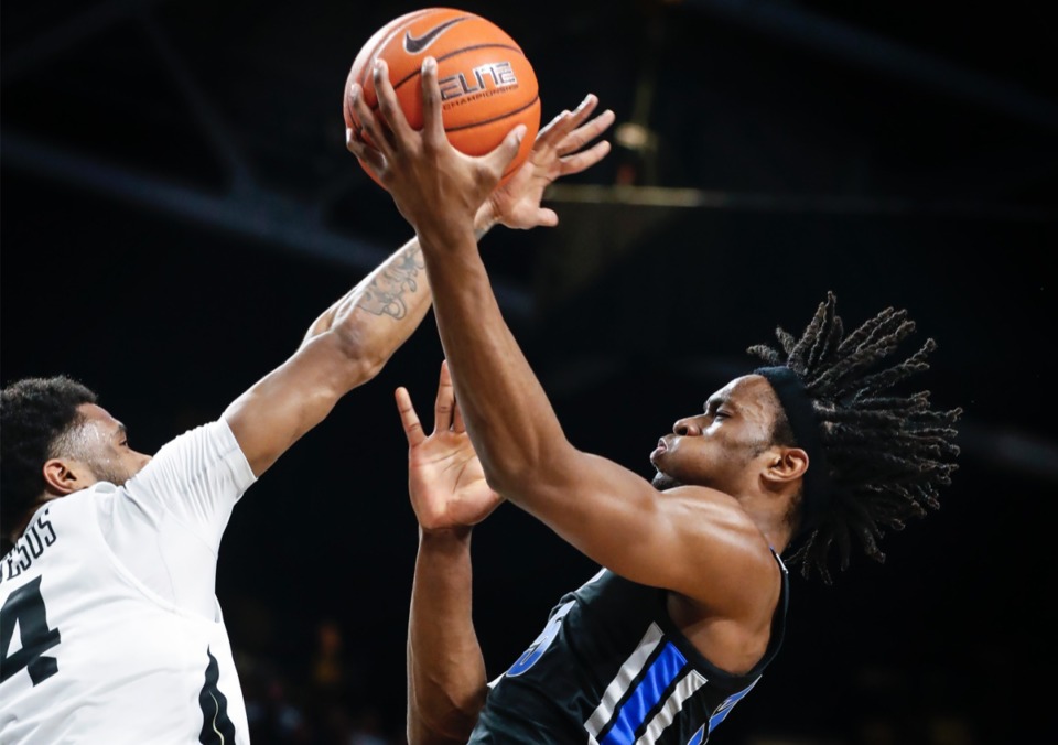 <strong>Memphis forward Precious Achiuwa (right) drives for a layup in front of UCF defender Ceasar DeJesus (left) Jan. 29, 2020, in Orlando.</strong> (Mark Weber/Daily Memphian)