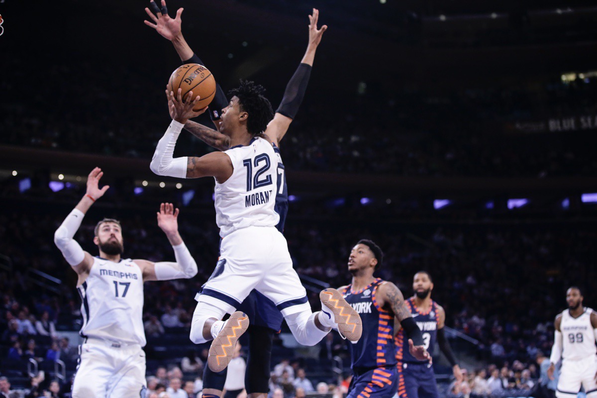<strong>Memphis Grizzlies' Ja Morant (12) drives past New York Knicks' Taj Gibson (67) an. 29, 2020, in New York. The Grizzlies won 127-106.</strong> (Frank Franklin II/AP)